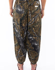 Back shot of a woman wearing Real Tree Camo day pants.