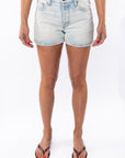 Woman wearing Denim Day Shorts.