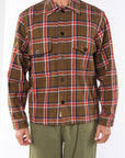 Man wearing Bucky Flannel Over shirt in Brown/Red with army green day pants