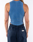 Back shot of a woman wearing Scallop Tank in Blue Wave and navy day pants