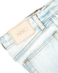 detail shot of the side of 'ARIKO' denim pockets and denim branding