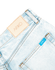 detail shot of backside of 'ARIKO' denim pockets and denim branding