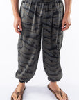 Ocean tiger camo day pants worn by a person on a white background