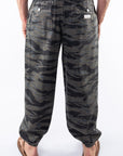 Back view of ocean tiger camo day pants worn by a person on a white background