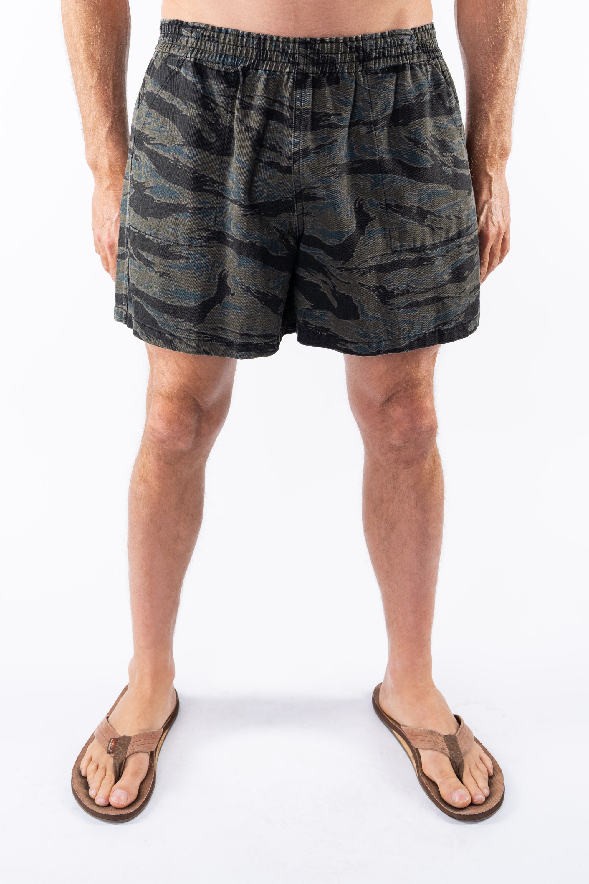 Ocean tiger Camouflage day shorts worn by a person on a white background