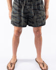 Ocean tiger Camouflage day shorts worn by a person on a white background