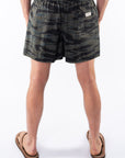 Back view of  Ocean tiger Camouflage day shorts worn by a person on a white background