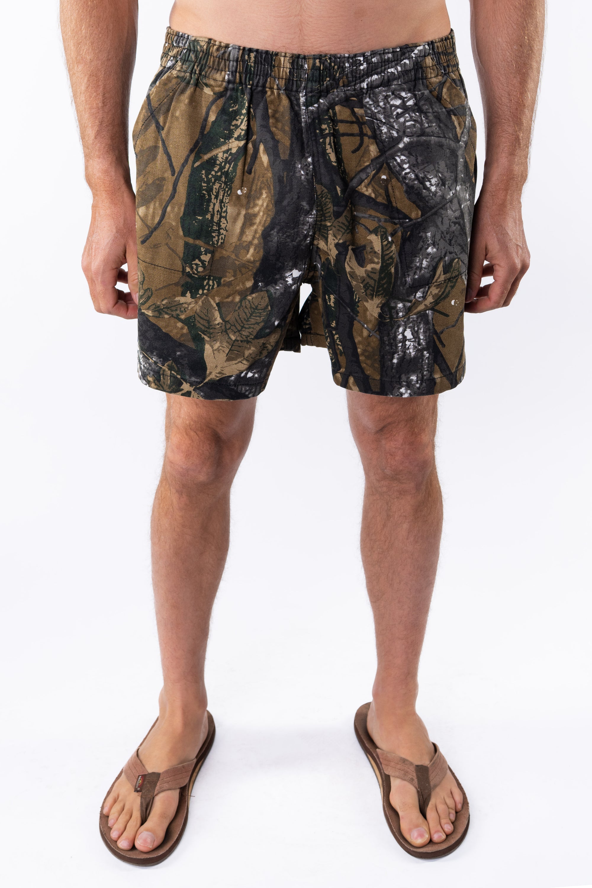 Person wearing real tree camouflage day shorts on a white background