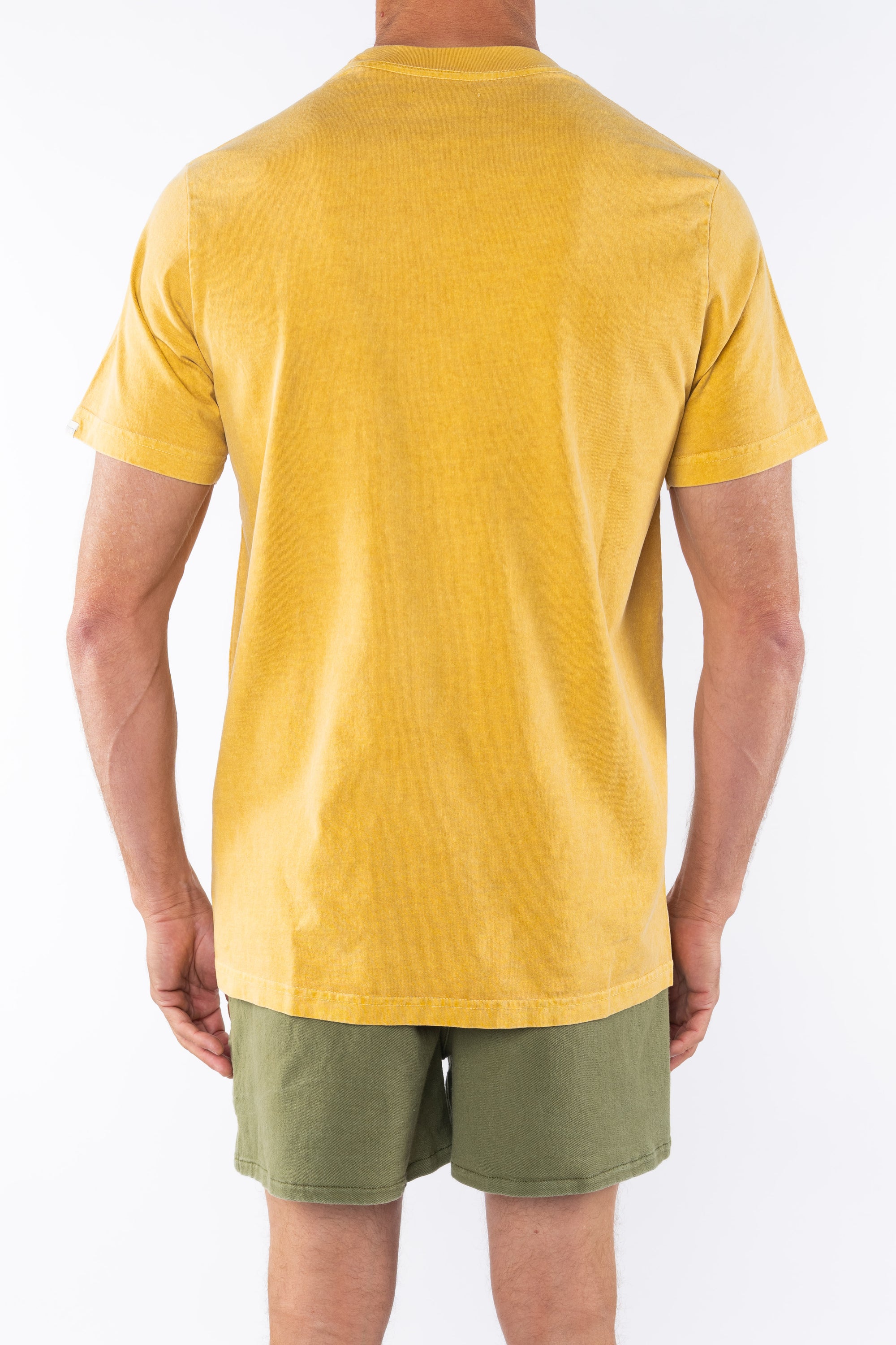 Back view of a person wearing a sunrise yellow beach t-shirt and army green day shorts on a white background