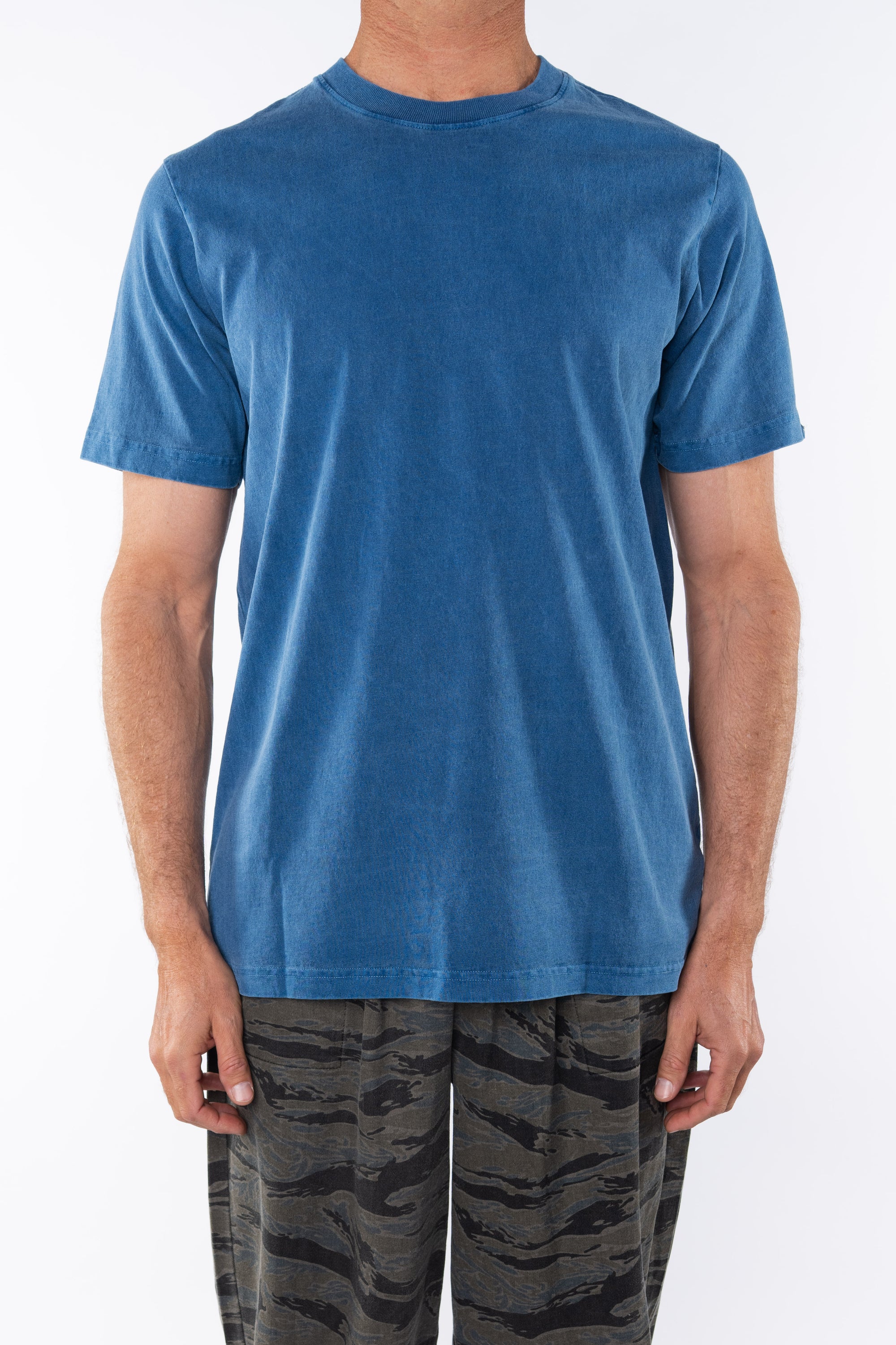 Man wearing Beach Crewneck T-shirt in Teal with Ocean Tiger Camo day pants.