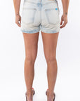 Back shot of a woman wearing Denim Day Shorts. 