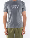 Man wearing OG Logo Graphic T-shirt in Sea Gray with Army Green day pants.