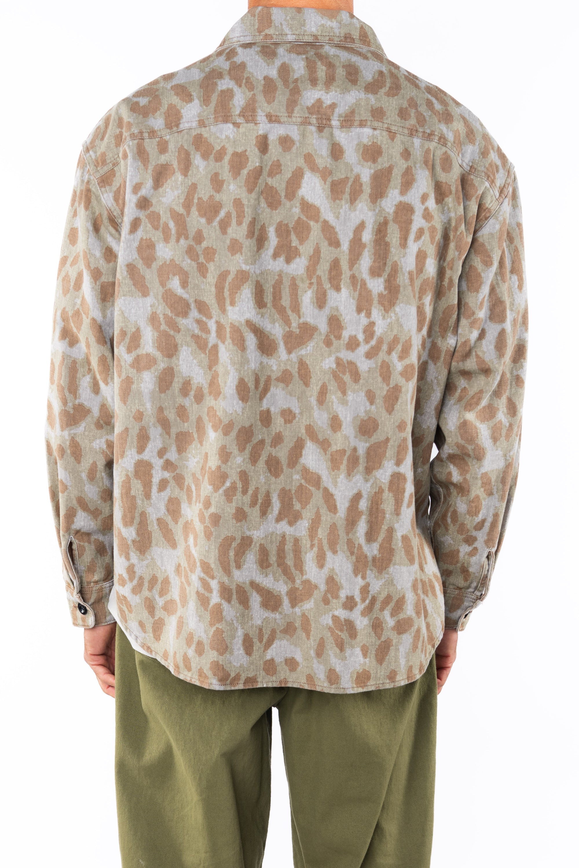 Back view of a person wearing a leopard camo bucky shirt jacket and army green day pants on a white background