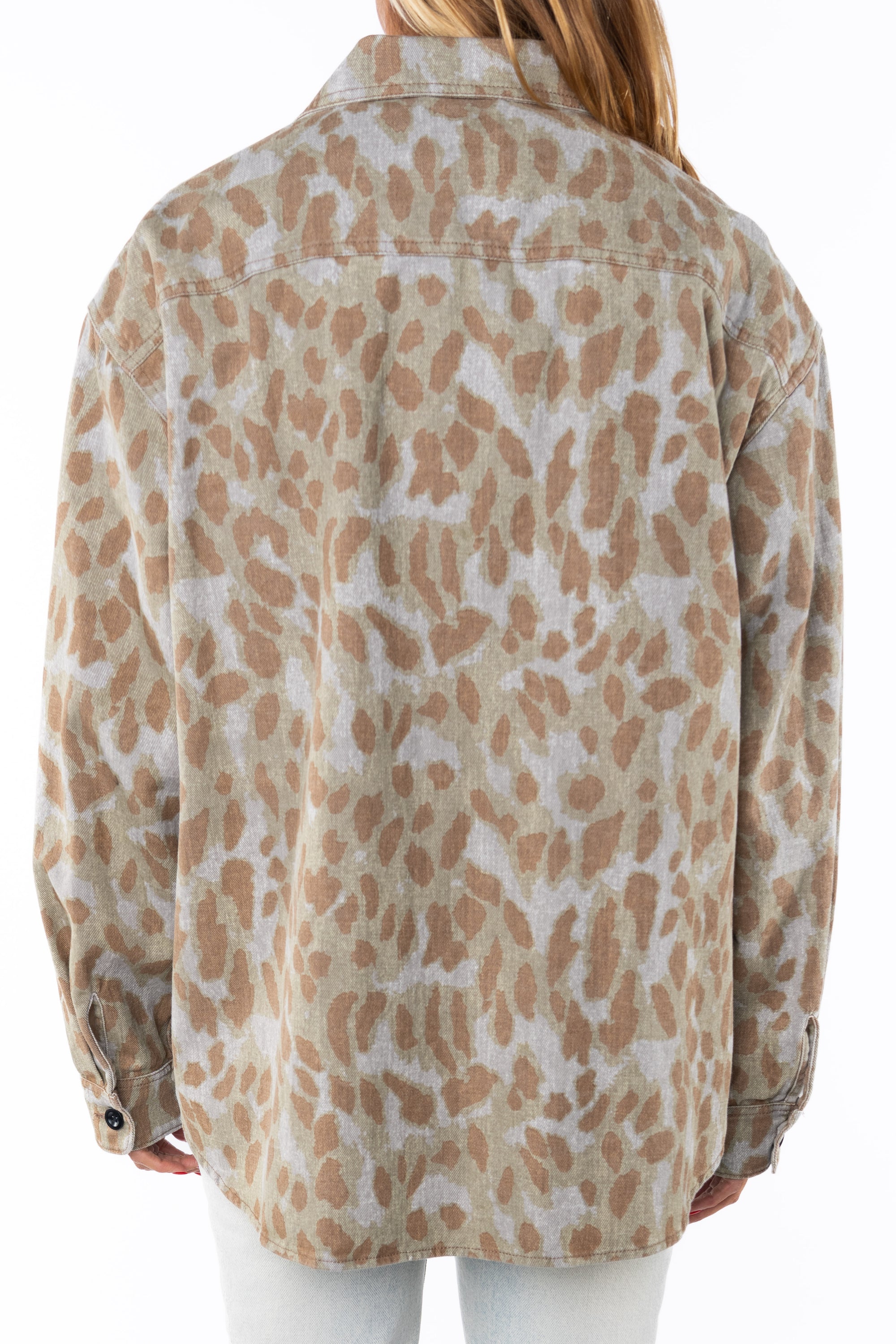 Back view of a woman wearing bucky Leopard camo print jacket worn by a person on a white background